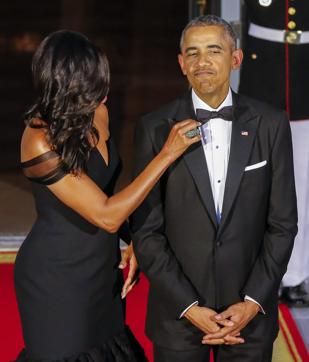 US President Barack Obama (R) has his bow tie adjusted by First Lady Michelle Obama (L) as they wait to greet President of China, Xi Jinping and Madame Peng Liyuan at the North Portico of the White House for a State Dinner in their honour. (EPA Photo) US President Barack Obama (R) has his bow tie adjusted by First Lady Michelle Obama (L) as they wait to greet President of China, Xi Jinping and Madame Peng Liyuan at the North Portico of the White House for a State Dinner in their honour. (EPA Photo)