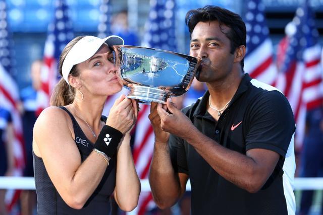 Martina Hingis of Switzerland and Leander Paes celebrate after defeating Bethanie Mattek-Sands of the United States and Sam Querrey of the United States in their final match of the 2015 US Open. (AFP Photo) Martina Hingis of Switzerland and Leander Paes celebrate after defeating Bethanie Mattek-Sands of the United States and Sam Querrey of the United States in their final match of the 2015 US Open. (AFP Photo)