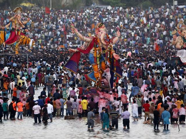 Devotees prepare to immerse idols of Lord Ganesha in the Arabian Sea in Mumbai. (AP Photo) Devotees prepare to immerse idols of Lord Ganesha in the Arabian Sea in Mumbai. (AP Photo)