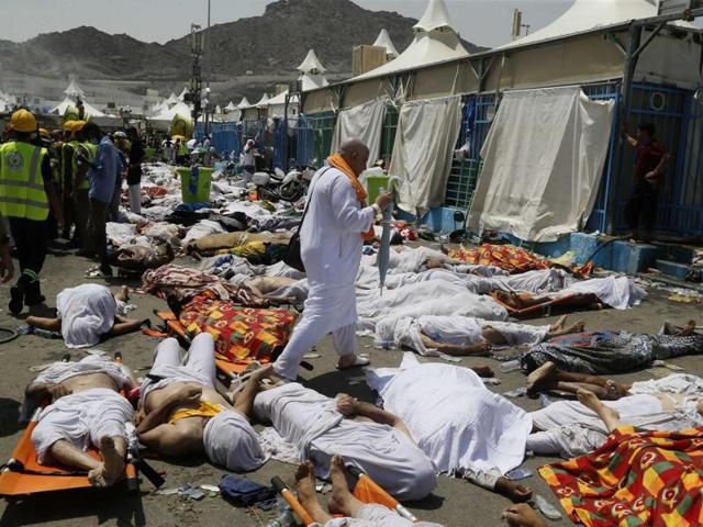 A muslim pilgrim walks through the site where dead bodies are gathered in Mina, Saudi Arabia during the annual haj pilgrimage on Thursday, Sept. 24, 2015. (AP PHOTO) A muslim pilgrim walks through the site where dead bodies are gathered in Mina, Saudi Arabia during the annual haj pilgrimage on Thursday, Sept. 24, 2015. (AP PHOTO)