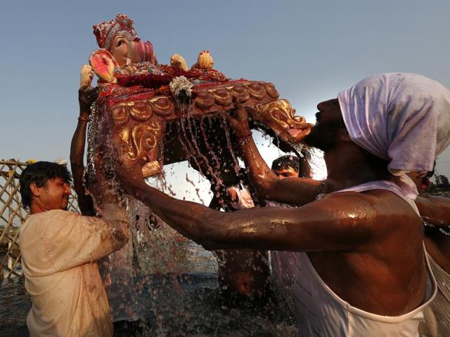 Idol of Lord Ganesha being immersed in Yamuna River at Okhla during the Ganesh Chaturthi festival in New Delhi. (Ravi Choudhary/ HT Photo) Idol of Lord Ganesha being immersed in Yamuna River at Okhla during the Ganesh Chaturthi festival in New Delhi. (Ravi Choudhary/ HT Photo)