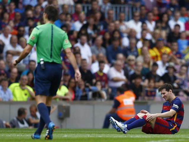 Barcelona's Lionel Messi reacts after getting injured during a La Liga match against Las Palmas at the Camp Nou stadium in Barcelona on September 26, 2015. (AP) Barcelona's Lionel Messi reacts after getting injured during a La Liga match against Las Palmas at the Camp Nou stadium in Barcelona on September 26, 2015. (AP)