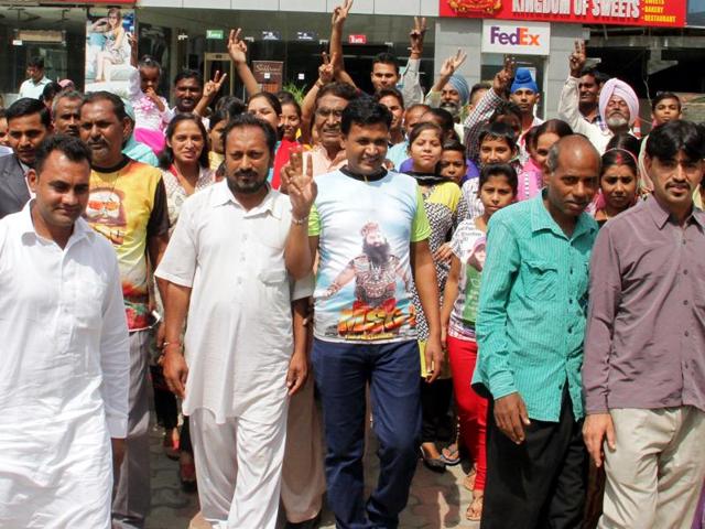 Followers of Gurmeet Ram Rahim coming out of Omaxe cinema after watching MSG-2  in Ludhiana on Sunday, September 27, 2015. (JS Grewal/HT Photo)