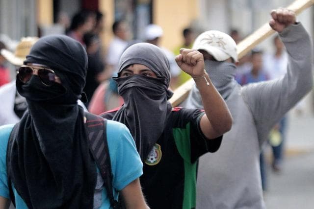 Students, local people and relatives of the 43 missing students from Ayotzinapa take part during a protest in Chilpancingo, Guerrero State, Mexico, on September 26, 2015, to commemorate the first anniversary of their disappearance. (AFP Photo) Students, local people and relatives of the 43 missing students from Ayotzinapa take part during a protest in Chilpancingo, Guerrero State, Mexico, on September 26, 2015, to commemorate the first anniversary of their disappearance. (AFP Photo)