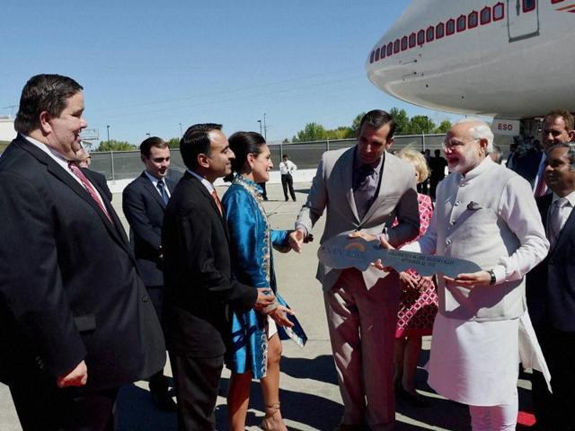 Prime Minister Narendra Modi is welcomed with a city key on his arrival at Norman Y. Mineta San José International Airport on Saturday. (PTI Photo)