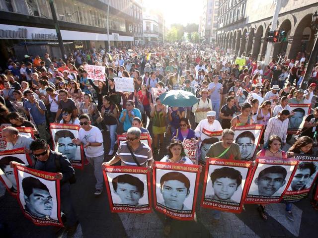 Thousands of people march asking justice as they hold banners of 43 missing Mexican students of the Ayotzinapa Rural Teachers' College during a rally marking one year anniversary since their disappearance, in Guadalajara, Mexico, 26 September 2015. (EPA Photo) Thousands of people march asking justice as they hold banners of 43 missing Mexican students of the Ayotzinapa Rural Teachers' College during a rally marking one year anniversary since their disappearance, in Guadalajara, Mexico, 26 September 2015. (EPA Photo)