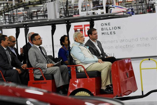 Prime Minister Narendra Modi takes ride in electric car during a visit of TESLA motors facility in San Jose on Saturday. (PTI) Prime Minister Narendra Modi takes ride in electric car during a visit of TESLA motors facility in San Jose on Saturday. (PTI)