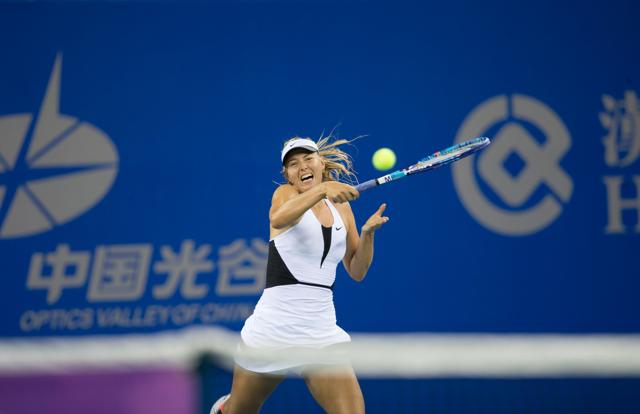 Russia's Maria Sharapova plays against Czech Republic's Barbora Strycova during their women's singles match at the Wuhan Open tennis tournament, Hubei province, China, September 28, 2015. Sharapova has withdrawn during the game from the tournament due to her injury, on Monday. (REUTERS) Russia's Maria Sharapova plays against Czech Republic's Barbora Strycova during their women's singles match at the Wuhan Open tennis tournament, Hubei province, China, September 28, 2015. Sharapova has withdrawn during the game from the tournament due to her injury, on Monday. (REUTERS)