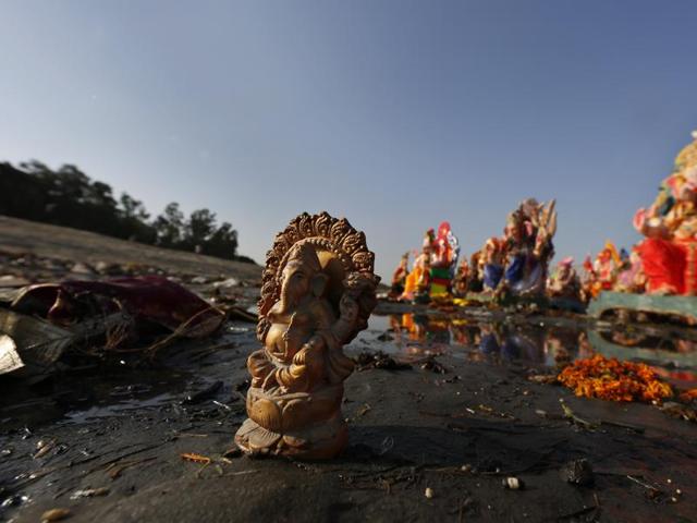 Generally made out of Plaster of Paris, these Idols do not disintegrate in water, and then lie stranded near the water bodies, like these ones on the banks of the polluted Yamuna river a day after Ganesh Chaturdashi, in New Delhi. (Ravi Choudhary/ Hindustan Times)