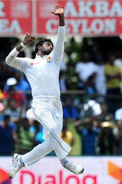 Tharindu Kaushal bowls during the fourth day of the second Test match against India at the P Sara Oval in Colombo, on August 23, 2015. (AFP Photo)