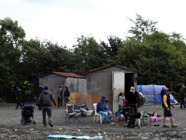 Migrants from Syria wait in the camp of Grande Synthe, before an attempt to get to Britain. (AP) Migrants from Syria wait in the camp of Grande Synthe, before an attempt to get to Britain. (AP)