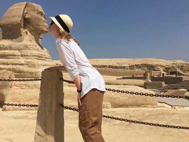 A tourist kisses the Sphinx in Giza. The Sphinx of Giza is the largest, oldest and the most famous monumental statues in the world, and an iconic symbol of Ancient Egypt. (AP)