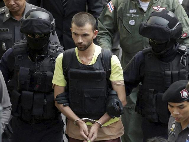 Bangkok : Police officers escort a key suspect in last month's Bangkok bombing, yellow shirt, identified as Adem Karadag at Erawan Shrine during a reenactment for the Aug. 17 bombing at Bangkok's popular Erawan Shrine. (AP) Bangkok : Police officers escort a key suspect in last month's Bangkok bombing, yellow shirt, identified as Adem Karadag at Erawan Shrine during a reenactment for the Aug. 17 bombing at Bangkok's popular Erawan Shrine. (AP)