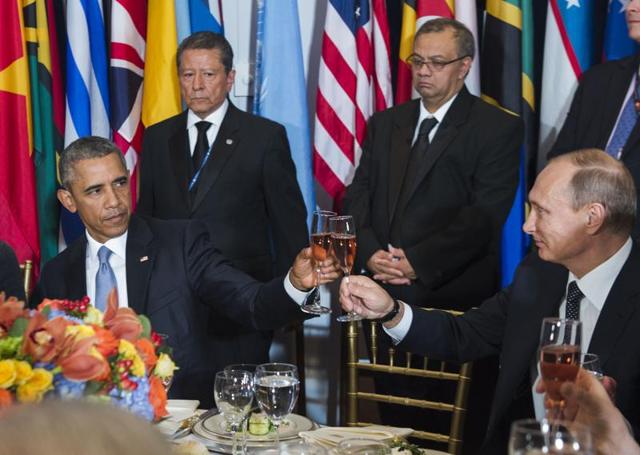 In this photo provided by the United Nations on Monday, Sept. 27, 2015, U.S. President Barack Obama, left, and Russian President Vladimir Putin toast during a luncheon hosted during the 70th annual United Nations General Assembly at U.N. headquarters. (Amanda Voisard/United Nations via AP) (AP) In this photo provided by the United Nations on Monday, Sept. 27, 2015, U.S. President Barack Obama, left, and Russian President Vladimir Putin toast during a luncheon hosted during the 70th annual United Nations General Assembly at U.N. headquarters. (Amanda Voisard/United Nations via AP) (AP)