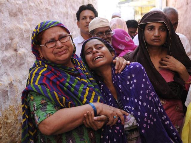 Sources said an animal carcass dumped in the middle of Greater Noida’s Bisada village sparked the incident. Mourning family members of Ihklaq are seen in this photo. (Burhaan Kinu /HT Photo) Sources said an animal carcass dumped in the middle of Greater Noida’s Bisada village sparked the incident. Mourning family members of Ihklaq are seen in this photo. (Burhaan Kinu /HT Photo)