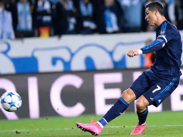 Real Madrid's Portuguese forward Cristiano Ronaldo shoots to score during the Uefa Champions League first-leg Group A match against Malmo FF at the Swedbank Stadion, in Malmo, Sweden on September 30, 2015. (AFP Photo) Real Madrid's Portuguese forward Cristiano Ronaldo shoots to score during the Uefa Champions League first-leg Group A match against Malmo FF at the Swedbank Stadion, in Malmo, Sweden on September 30, 2015. (AFP Photo)