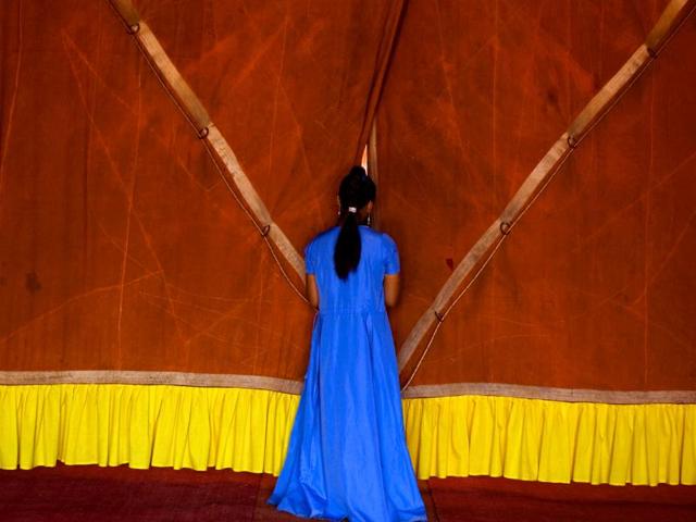 Bangalore 2008: Behind the scenes of the circus, a young woman awaits her turn (Clare Arni) Bangalore 2008: Behind the scenes of the circus, a young woman awaits her turn (Clare Arni)