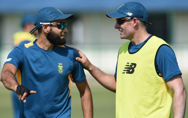 South Africa's Imran Tahir, left, talks with consultant Michael Hussey at a practice session. (AFP Photo) South Africa's Imran Tahir, left, talks with consultant Michael Hussey at a practice session. (AFP Photo)