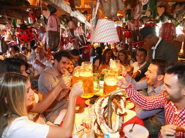 German club Bayern Munich's players toast as they visit the Oktoberfest beer festival 2015 at Theresienwiese in Munich, southern Germany. (AP Photo)
