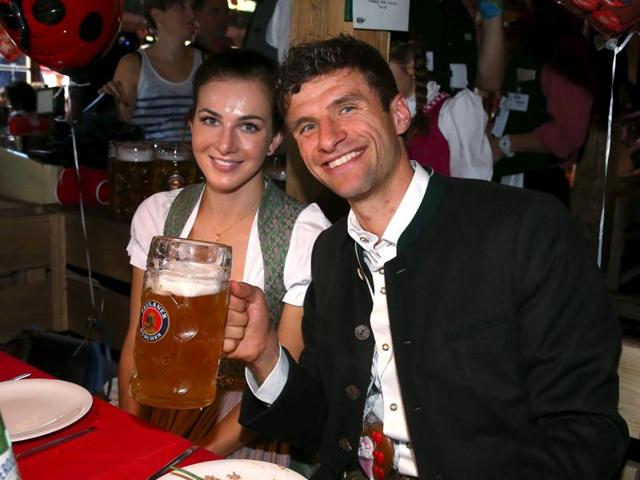 Bayern Munich forward Thomas Mueller and his partner Lisa pose at the Oktoberfest in Munich, Germany. (Reuters Photo)