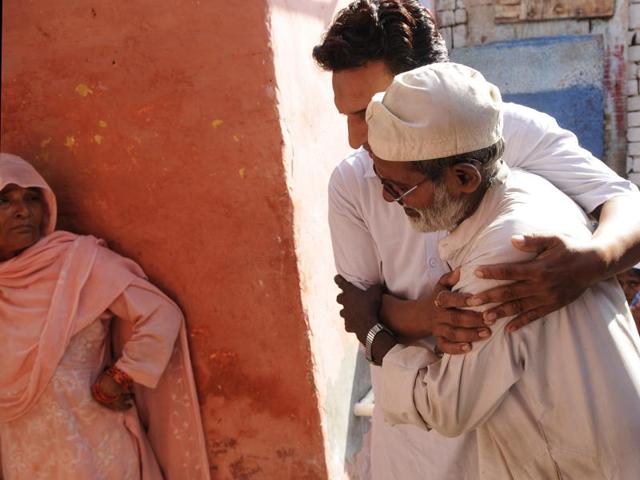 Additional district magistrate Rajesh Yadav speaks with Ikhlaq's family.(HT Photo)