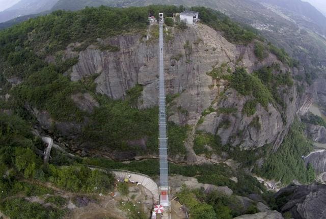 An aerial view shows a glass suspension bridge at the Shiniuzhai National Geo-park in Pinging county, Hunan province, China (REUTERS)