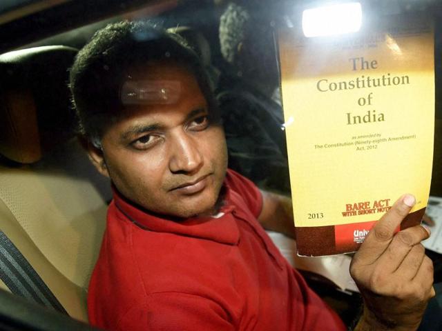 New Delhi: AAP MLA Somnath Bharti shows a book of Constitution of India as he arrives to surrender at the Dwarka North Police Station in New Delhi on Monday. PTI Photo by Manvender Vashist (PTI9_28_2015_000359a) (PTI) New Delhi: AAP MLA Somnath Bharti shows a book of Constitution of India as he arrives to surrender at the Dwarka North Police Station in New Delhi on Monday. PTI Photo by Manvender Vashist (PTI9_28_2015_000359a) (PTI)