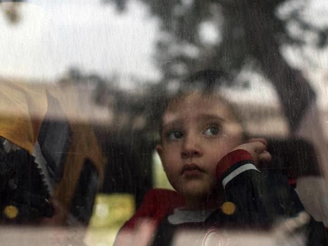 A refugee child looks through a bus window as they leave for Istanbul, abandoning plans to cross to Europe near Turkey’s western border with Greece and Bulgaria, in Edirne. (AP Photo) A refugee child looks through a bus window as they leave for Istanbul, abandoning plans to cross to Europe near Turkey’s western border with Greece and Bulgaria, in Edirne. (AP Photo)