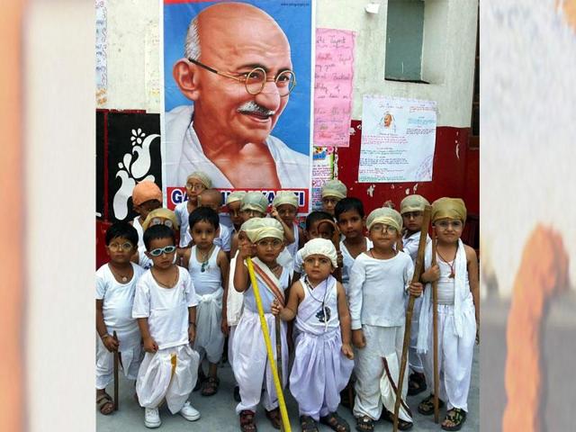 School children celebrate the birth anniversary of Mahatma Gandhi ,in Jammu. (Nitin Kanotra/ HT Photo) 