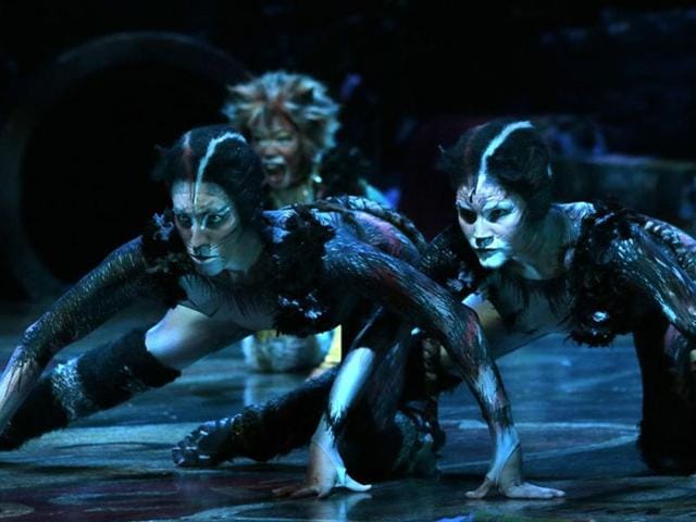 Cast members perform excerpts of the musical Cats, based on TS Eliot’s Old Possum’s Book of Practical Cats, a collection of poems about feline psychology and sociology, on October 1, 2015 onstage in Paris. (AFP)
