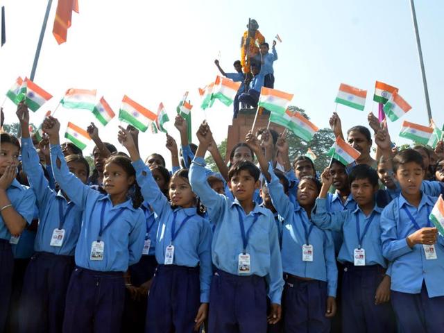Amritsar, India 02 October 2015: Students of Nishkam Sewa Public School hold the tricolour as they pay tributes to Mahatma Gandhi on the occasion of Gandhi Jayanti at company bagh garden in Amritsar on Friday. October 02 2015 (Photo by Sameer Sehgal / Hindustan Times ) (Sameer Sehgal / HT)