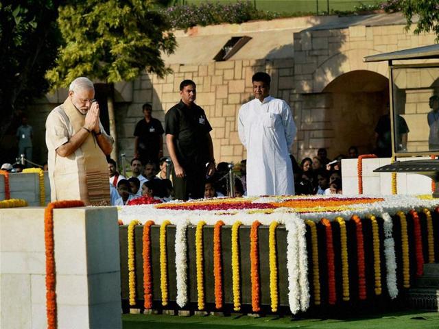 Prime Minister Narendra Modi pays tributes at Rajghat, Mahatma Gandhi’s memorial, on his 146th birth anniversary, in New Delhi on Friday.  (PTI Photo) 