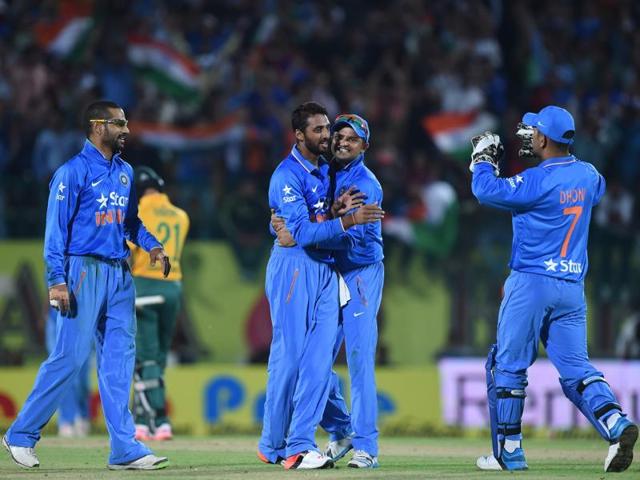 India's Sreenath Aravind (centre, left) celebrates with teammates after he claimed the wicket of South Africa's captain Faf du Plessis. (AFP Photo)