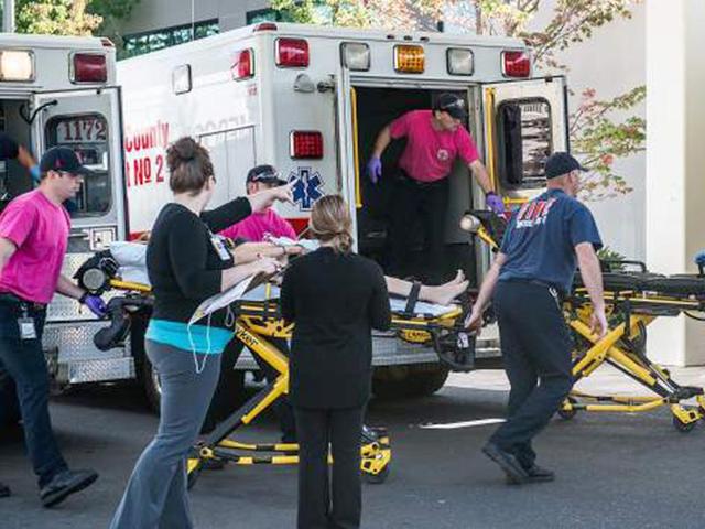 Friends and family are reunited with students at the local fairgrounds after a deadly shooting at Umpqua Community College, in the US State of Oregon.(AP Photo)