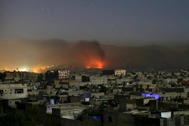 Smoke rises during clashes between forces loyal to Syria's President Bashar al-Assad and the Army of Islam fighters, on the eastern mountains of Qalamoun overlooking the town of Douma, eastern Ghouta in Damascus. (REUTERS) Smoke rises during clashes between forces loyal to Syria's President Bashar al-Assad and the Army of Islam fighters, on the eastern mountains of Qalamoun overlooking the town of Douma, eastern Ghouta in Damascus. (REUTERS)