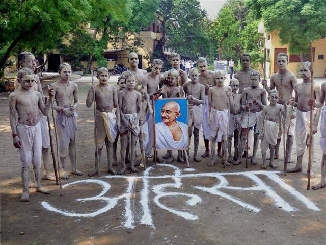 Children dressed up as Mahatma Gandhi take part in a program to pay their respect to the leader of Indian freedom struggle, in Moradabad.  (PTI Photo) 
