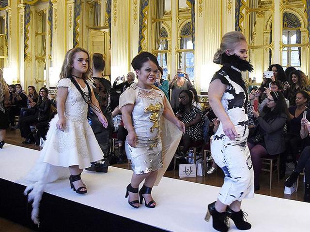 Models present creations during the National Dwarf Fashion Show on October 2, 2015 during in Paris. (AFP)