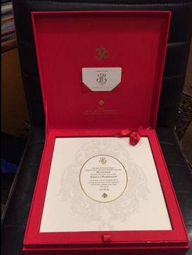 The red-and-gold wedding invite is embossed with Harbhajan and Geeta’s initials.