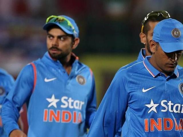 India's captain Mahendra Singh Dhoni (R) and Virat Kohli walk off the ground after losing against South Africa during their first Twenty-20 cricket match in Dharamsala. (REUTERS)