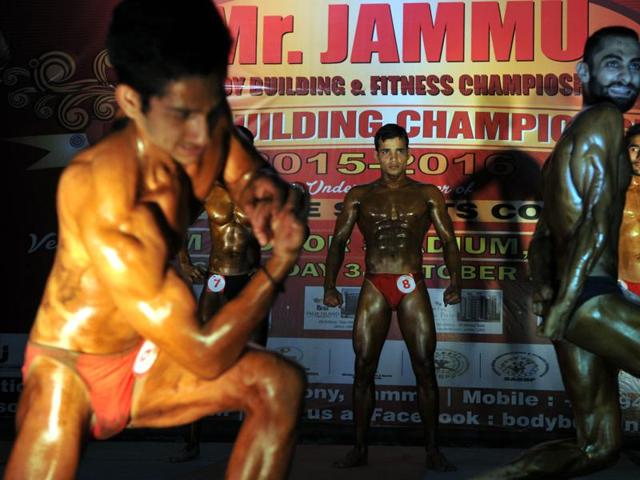 Body-builders pose during the 'Mr. Jammu Body Building Competition' in Jammu. (Nitin Kanotra / HT)