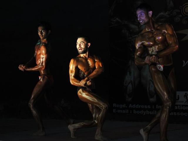 Body-builders pose during the 'Mr. Jammu Body Building Competition' in Jammu,on Saturday. (Nitin Kanotra / HT)