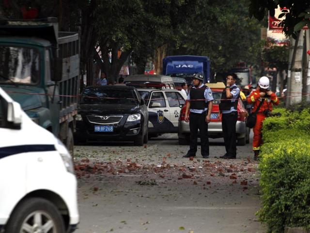 Police stand guard after a blast occurred in the early morning in Liucheng, a rural county of the Guangxi region. (AFP Photo) Police stand guard after a blast occurred in the early morning in Liucheng, a rural county of the Guangxi region. (AFP Photo)