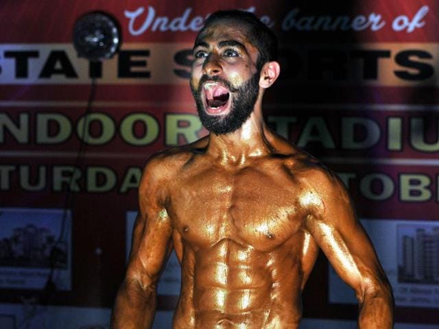 A body-builders shouts after his selection in the first round during the 'Mr. Jammu Body Building Competition'. (Nitin Kanotra / HT)