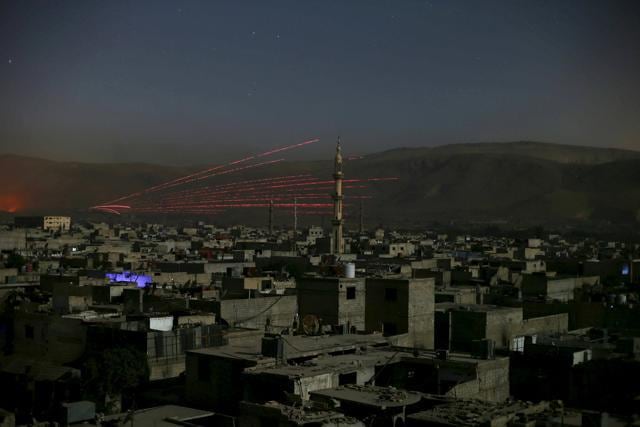 Fire trails are seen during clashes between forces loyal to Syria's President Bashar al-Assad and the Army of Islam fighters, on the eastern mountains of Qalamoun, in Damascus. (Reuters Photo) Fire trails are seen during clashes between forces loyal to Syria's President Bashar al-Assad and the Army of Islam fighters, on the eastern mountains of Qalamoun, in Damascus. (Reuters Photo)
