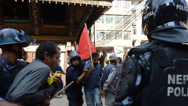 Nepalese police arrest a demonstrator during a general strike called by a hardline breakaway faction of former Maoist rebels (Communist Party of Nepal-Maoist) against the draft of the new constitution in Kathmandu on September 20,2015 even as the Himalayan nation adopted a new national constitution on Sunday (AFP Photo) Nepalese police arrest a demonstrator during a general strike called by a hardline breakaway faction of former Maoist rebels (Communist Party of Nepal-Maoist) against the draft of the new constitution in Kathmandu on September 20,2015 even as the Himalayan nation adopted a new national constitution on Sunday (AFP Photo)