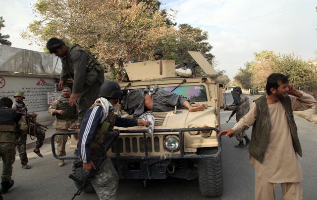 Afghan security forces take a wounded civilian man to the hospital after Taliban fighter's attack, in Kunduz city, north of Kabul, Afghanistan, Saturday. (AP Photo) Afghan security forces take a wounded civilian man to the hospital after Taliban fighter's attack, in Kunduz city, north of Kabul, Afghanistan, Saturday. (AP Photo)