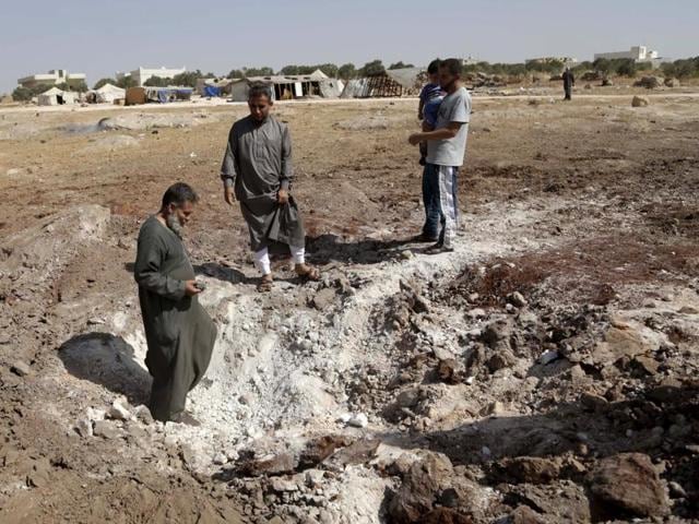 A site of airstrikes carried out by the Russian air force near a camp for displaced people on the outskirts of al-Ghadfa town, in the southern countryside of Idlib in Syria. (REUTERS) A site of airstrikes carried out by the Russian air force near a camp for displaced people on the outskirts of al-Ghadfa town, in the southern countryside of Idlib in Syria. (REUTERS)