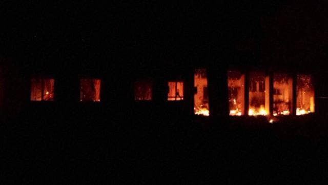 The Doctors Without Borders trauma centre is seen in flames after explosions near their hospital, in the northern Afghan city of Kunduz. (AP Photo)