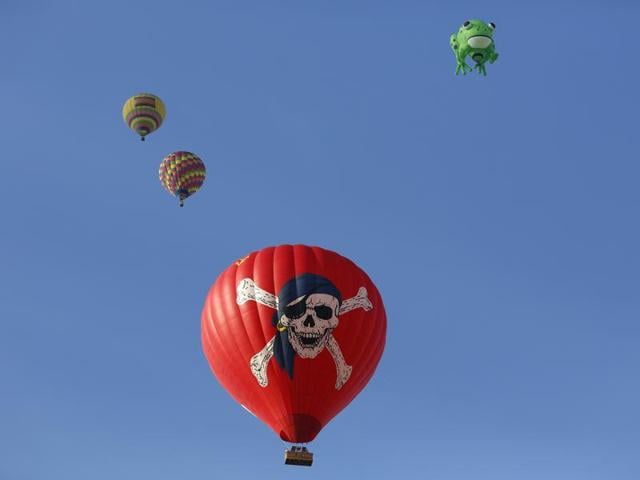 Hot air balloons fly during the opening day of the 44th International Balloon Fiesta in Albuquerque, N.M., Saturday, Oct. 3, 2015. (AP)