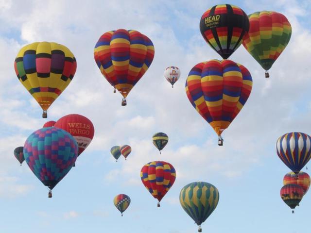 A combination of factors makes Albuquerque the perfect place for the fiesta: typically clear skies, cool mornings and wind patterns at various elevations that help keep the balloons aloft over the city. (AP)